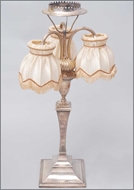 Picture of An Empire style Hallmarked silver three arms quadrefoil table-lamp (lot 13)