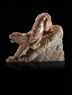 Picture of AN ALABASTER-MARBLE SCULPTURE OF A LIONESS CREEPING DOWN A ROCKY PATH