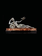 Picture of A RECLINING ART DECO PEWTER FIGURINE
